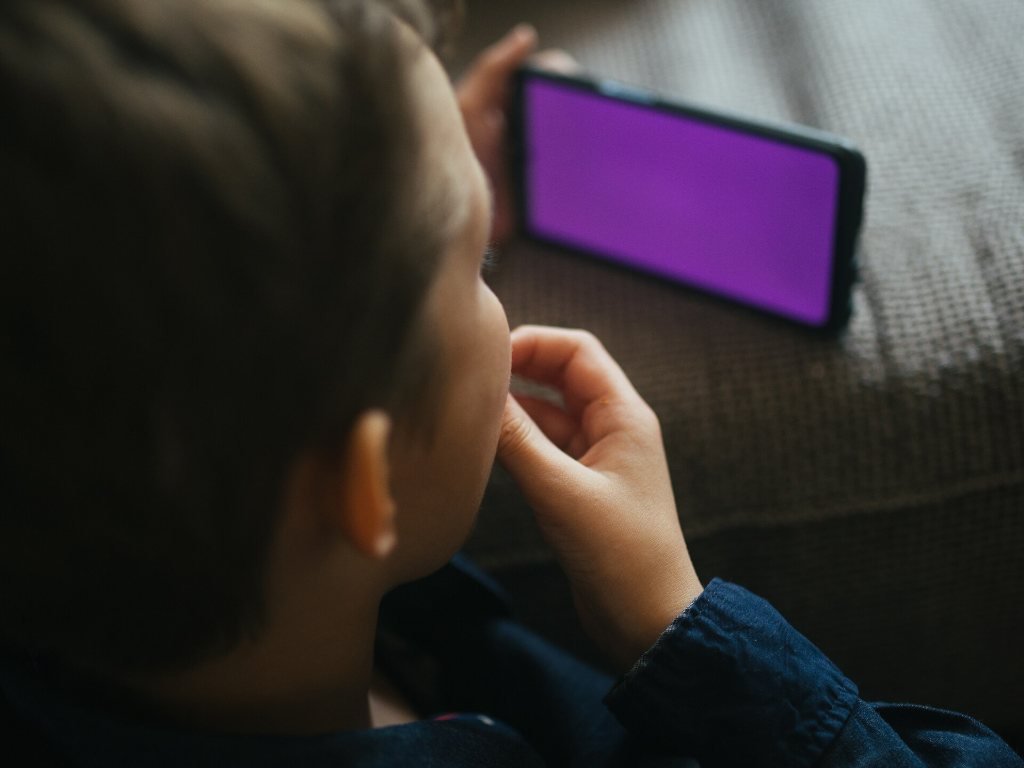 A child holding a smartphone