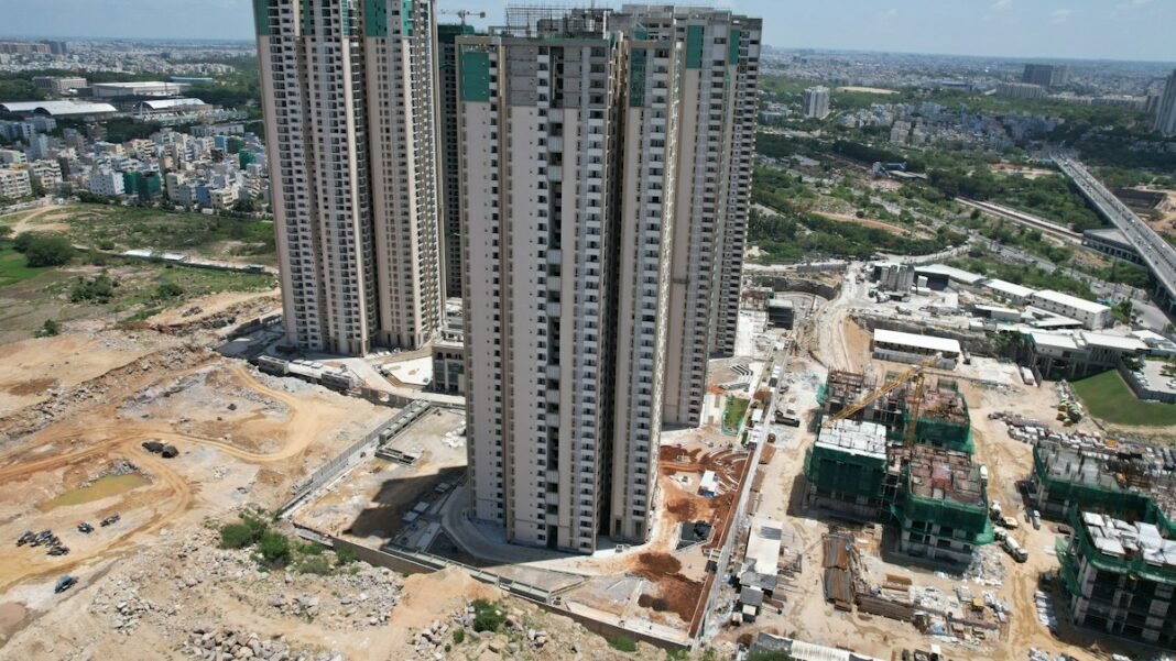 Aerial view of high-rise apartment towers under construction in an Indian city