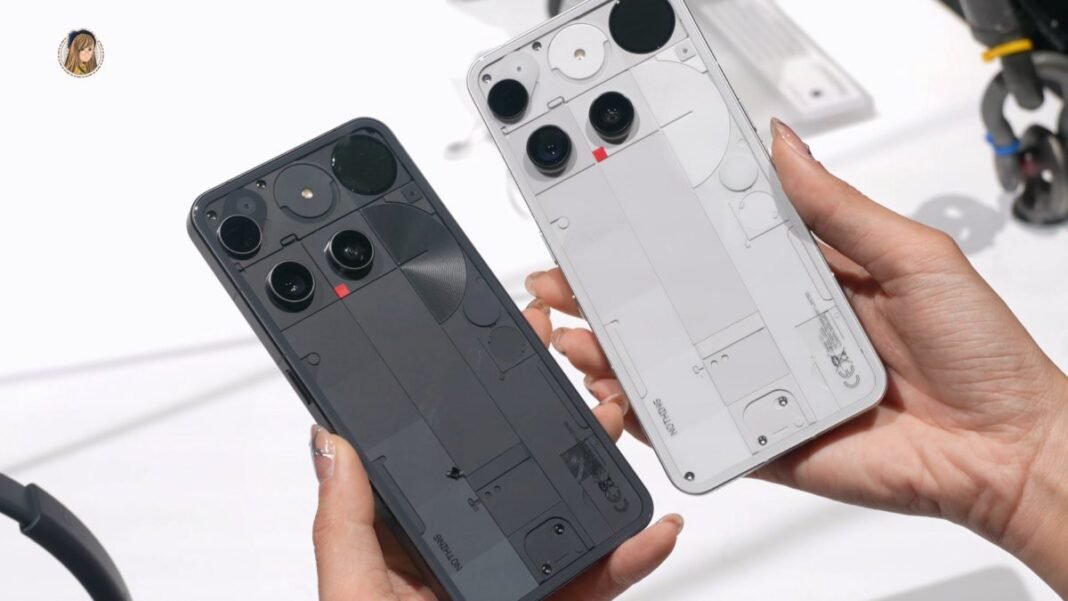 Two hands holding the transparent-back Nothing Phone (3)